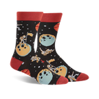 A pair of black crew socks with a space theme. Astronauts, planets, and moons are illustrated in teal, orange, and red.