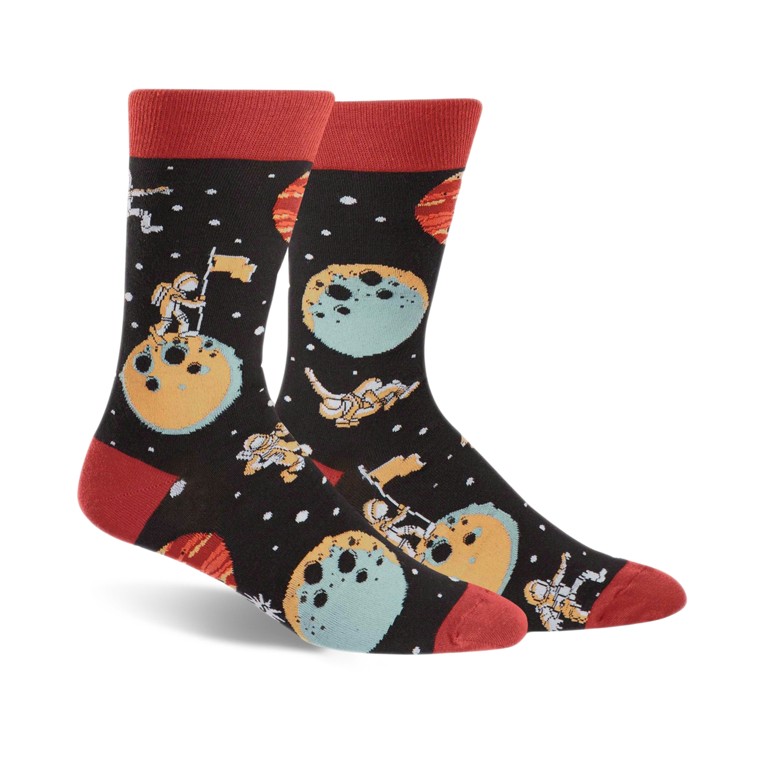 A pair of black crew socks with a space theme. Astronauts, planets, and moons are illustrated in teal, orange, and red.