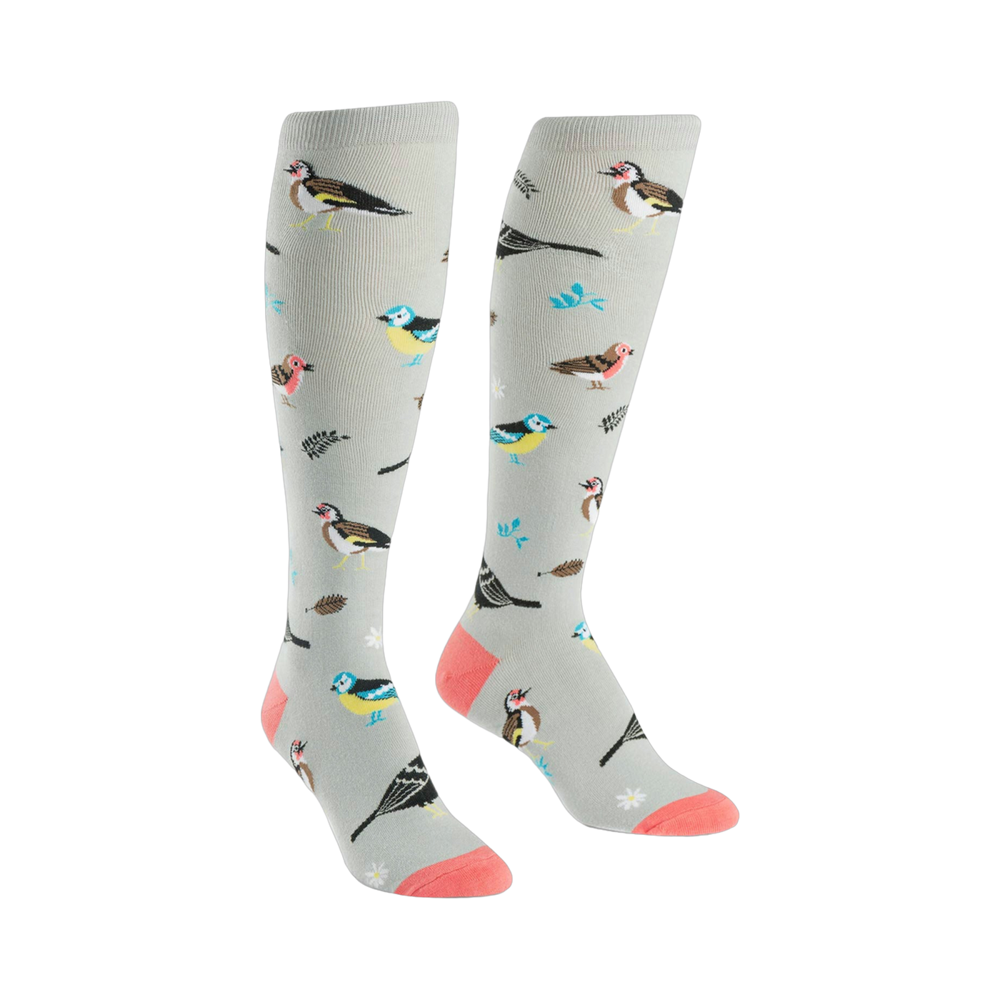 A pair of women's knee-high socks in light gray with a pattern of colorful birds and leaves. Coral-colored heel and toe.