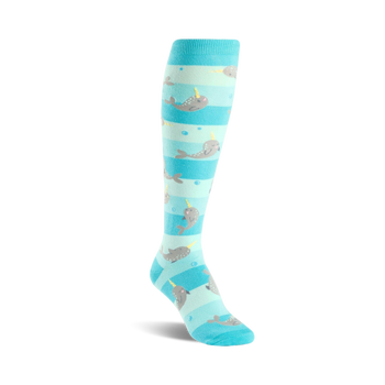 knee-high women's socks with cartoon narwhal pattern on blue and white stripes.  
