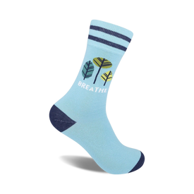 light blue socks with blue, green, and yellow leaves and the word "breathe" in white. crew length. for men and women.  