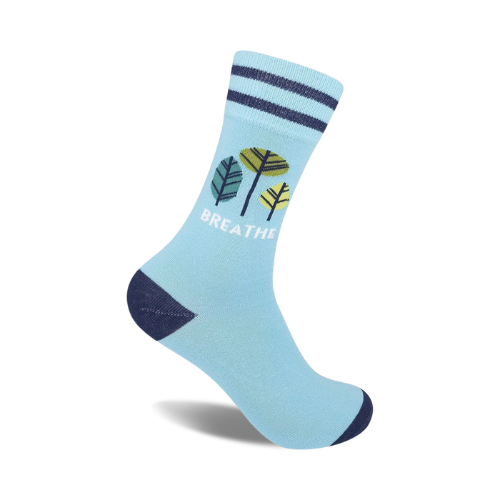light blue socks with blue, green, and yellow leaves and the word 