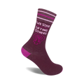 Burgundy crew socks with pink stripes and 'We Rise by Lifting Others' text alongside a feminist fist symbol.