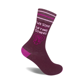 inspirational crew socks for women. purple socks with message, we rise by lifting others. pink & white striped band, pink heel/toe.  