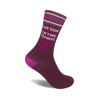 inspirational crew socks for women. purple socks with message, we rise by lifting others. pink & white striped band, pink heel/toe.  
