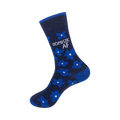 Close-up view of a navy blue crew sock showcasing the bright blue flower pattern and 'DOMESTIC AF' text.