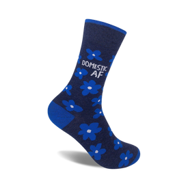 mid-calf socks with a pattern of light blue flowers and the words "domestic af" displayed vertically on the leg of the sock. crew length.  