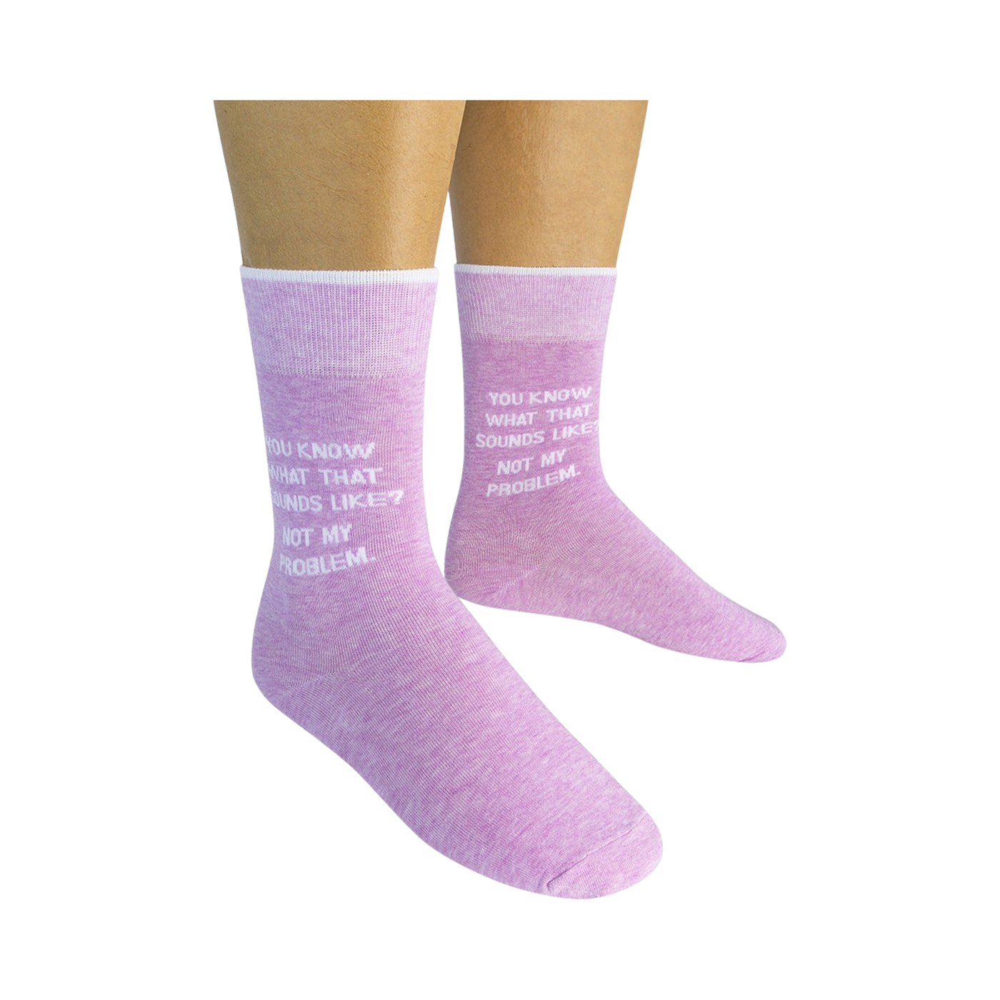 Lifestyle shot showing a person wearing a pair of lavender 'Not My Problem' crew socks.