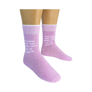 A pair of purple socks with white text that reads, 