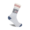 Crew socks in off-white with a light blue grid pattern.  Red and black text reads 'Science Doesn't Care What You Believe'.  Navy blue heel and toe.