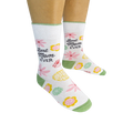 Lifestyle photo showing a person wearing a pair of 'Best Mom Ever' socks.