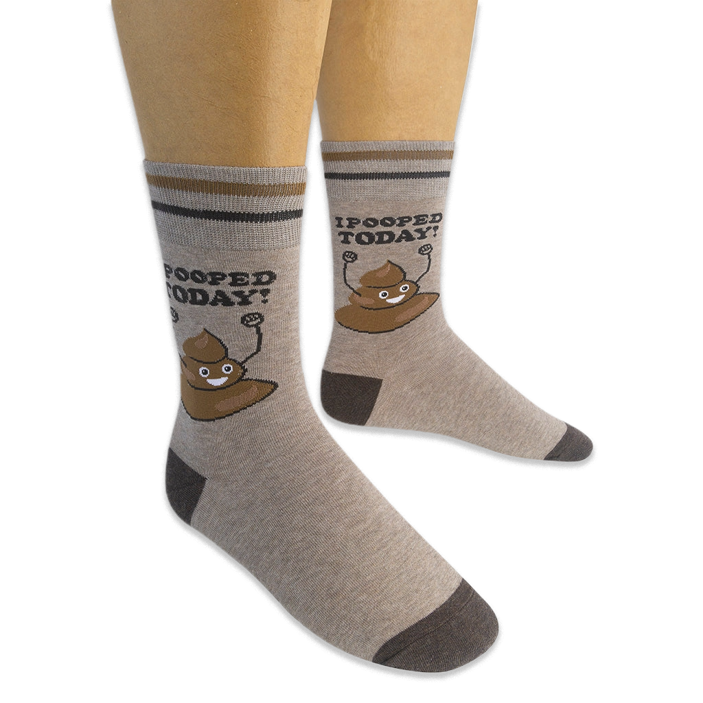 Mannequin legs wearing tan crew socks displaying a happy poop cartoon and I POOPED TODAY! text on the outer sides.