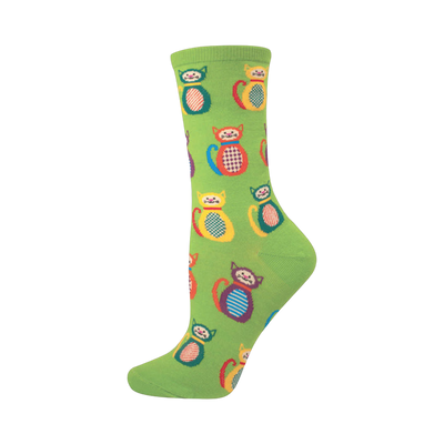 Crew socks in lime green with a pattern of colorful patchwork kitties. The cats are in various colors, including red, yellow, and blue.