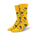 Pair of yellow crew socks with repeating pattern of a person skateboarding.  Skater is depicted in red, green, blue and black against the bright yellow background.