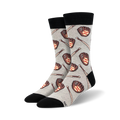 A pair of grey crew socks with a pattern of brown baseball gloves and bats.  The socks have black cuffs.