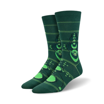 dark green men's crew socks with a pattern of crop circles in a lighter shade of green.  