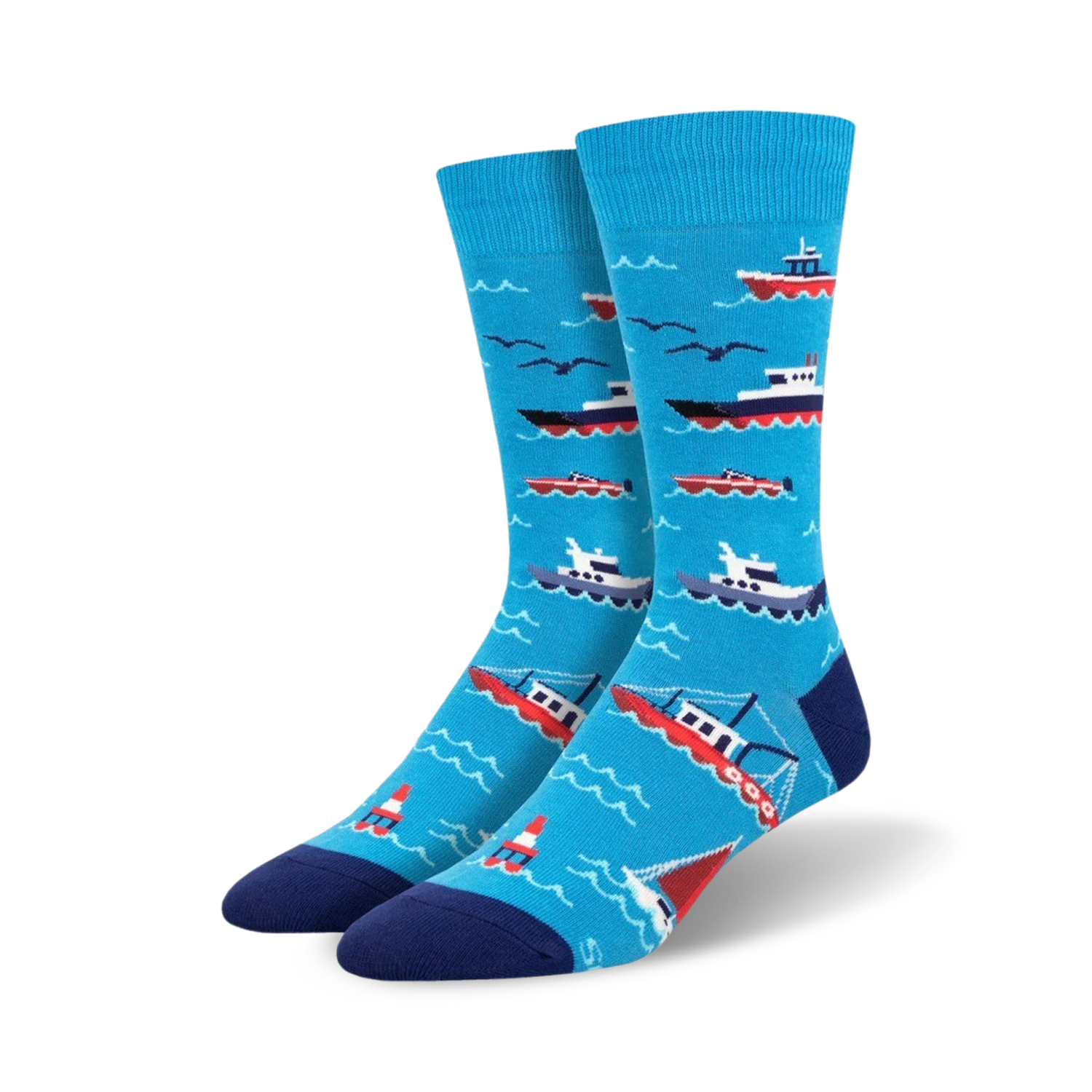 A pair of blue crew socks with illustrated red and white boats, seagulls, and buoys on a wavy ocean pattern. 