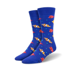 Pair of blue crew socks with colorful clownfish and red fish designs. Teal bubbles are scattered throughout.