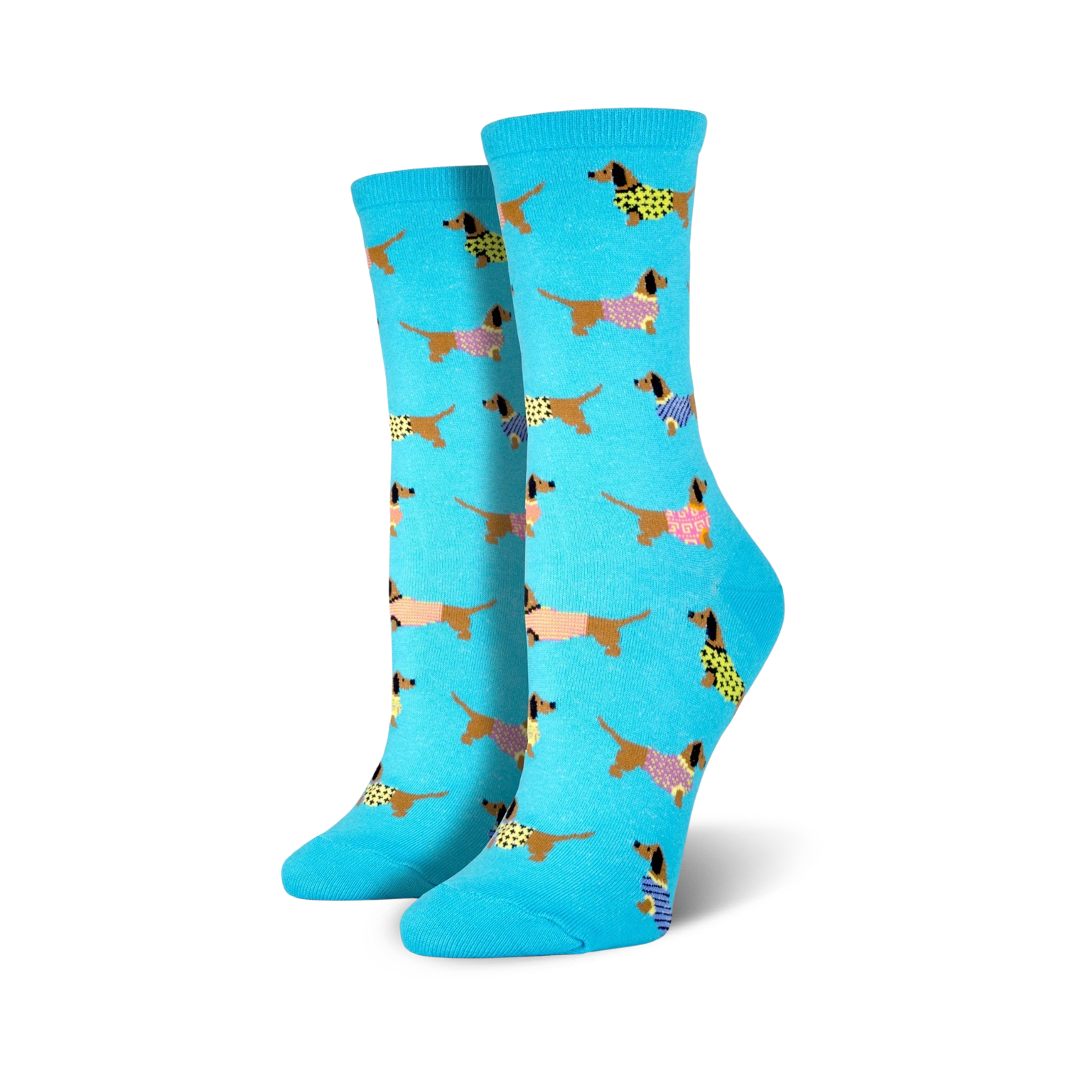 Pair of women's crew socks; light teal background with repeating pattern of brown dachshunds wearing colorful sweaters.