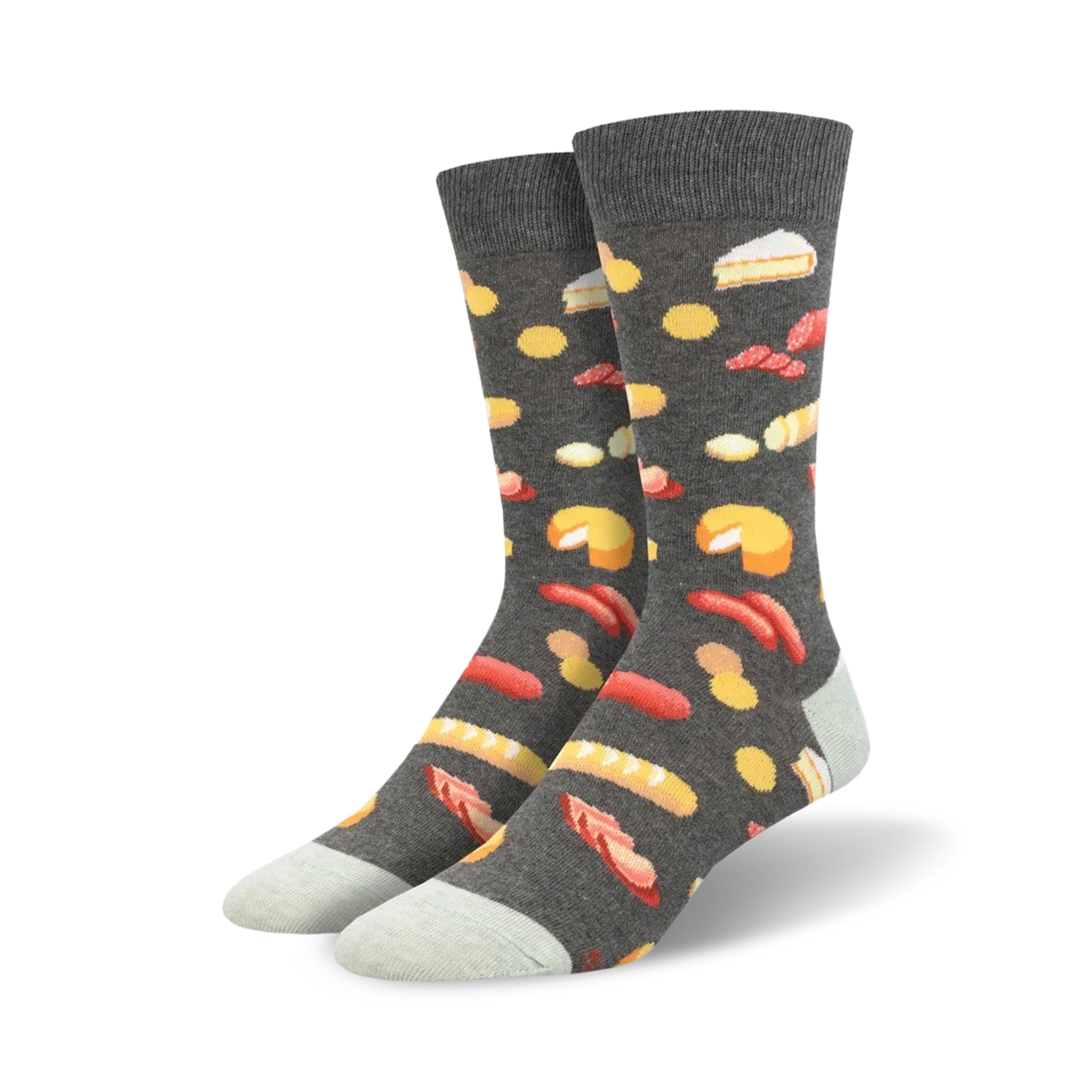 Pair of crew socks with a charcuterie board design.  Dark grey background with illustrations of cheese, sausage, bread, and other charcuterie items in yellow, red, and white.