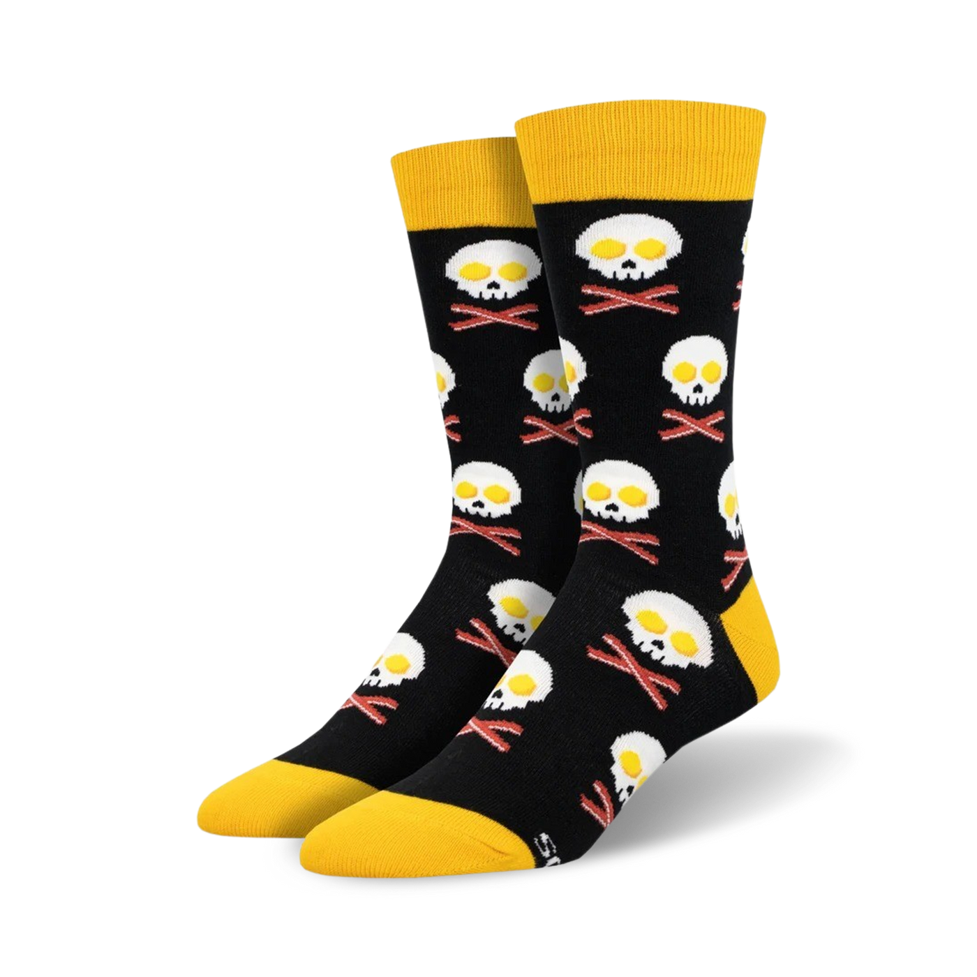 A pair of black crew socks with a fun design.  Yellow-topped socks feature skulls made of fried eggs and crossed bacon bones.