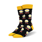 A pair of black crew socks with a fun design.  Yellow-topped socks feature skulls made of fried eggs and crossed bacon bones.