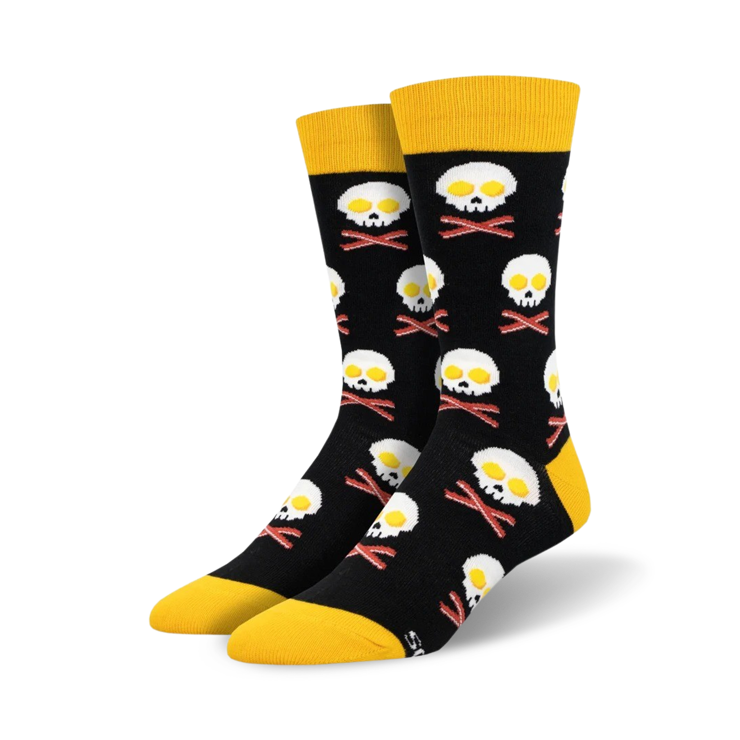 A pair of black crew socks with a fun design.  Yellow-topped socks feature skulls made of fried eggs and crossed bacon bones.