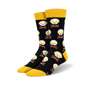 black crew socks with bacon and eggs pattern, yellow toe, heel, and top.  eggs are shaped like a skull and bacon like crossbones