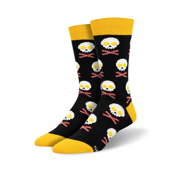 black crew socks with bacon and eggs pattern, yellow toe, heel, and top.  eggs are shaped like a skull and bacon like crossbones }}