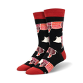 Pair of black crew socks with red and white pig illustrations and tasting notes.  Words like 'yum', 'tasty', and 'good' decorate each pig.