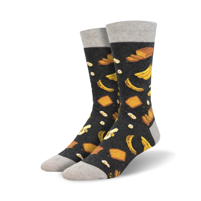 crew length men's socks feature a repeated pattern of bananas, bread slices, and fried eggs on a dark background.    }}