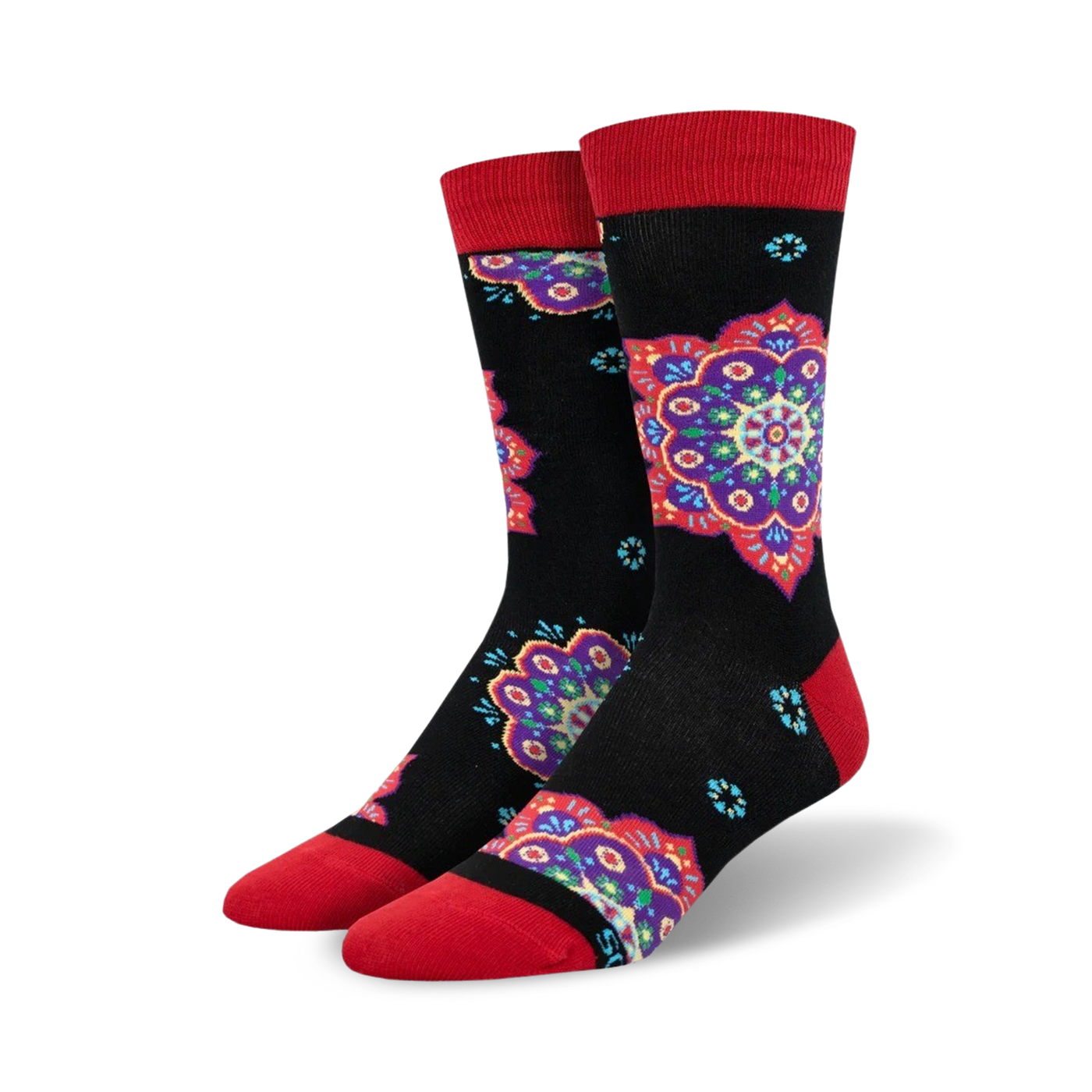A pair of crew socks with a black background and colorful mandala designs in shades of purple, red, and teal. The socks have red cuffs.