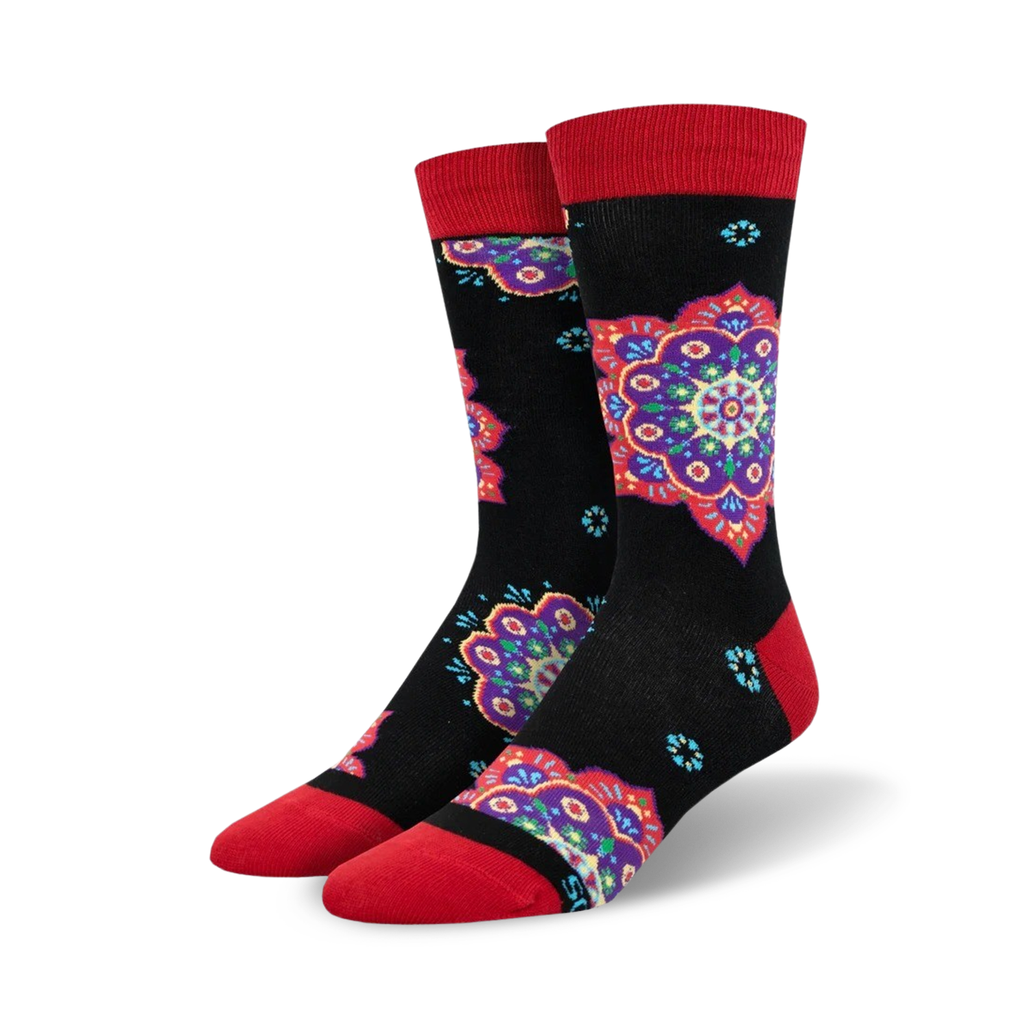 A pair of crew socks with a black background and colorful mandala designs in shades of purple, red, and teal. The socks have red cuffs.