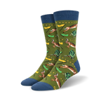 A pair of crew socks in olive green with blue cuffs. The design features a repeating pattern of hares and tortoises in a race, with small flags.