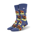 Pair of blue crew socks with a repeating pattern of Highland Cows.  The cows are brown and white, set against a pale yellow background.