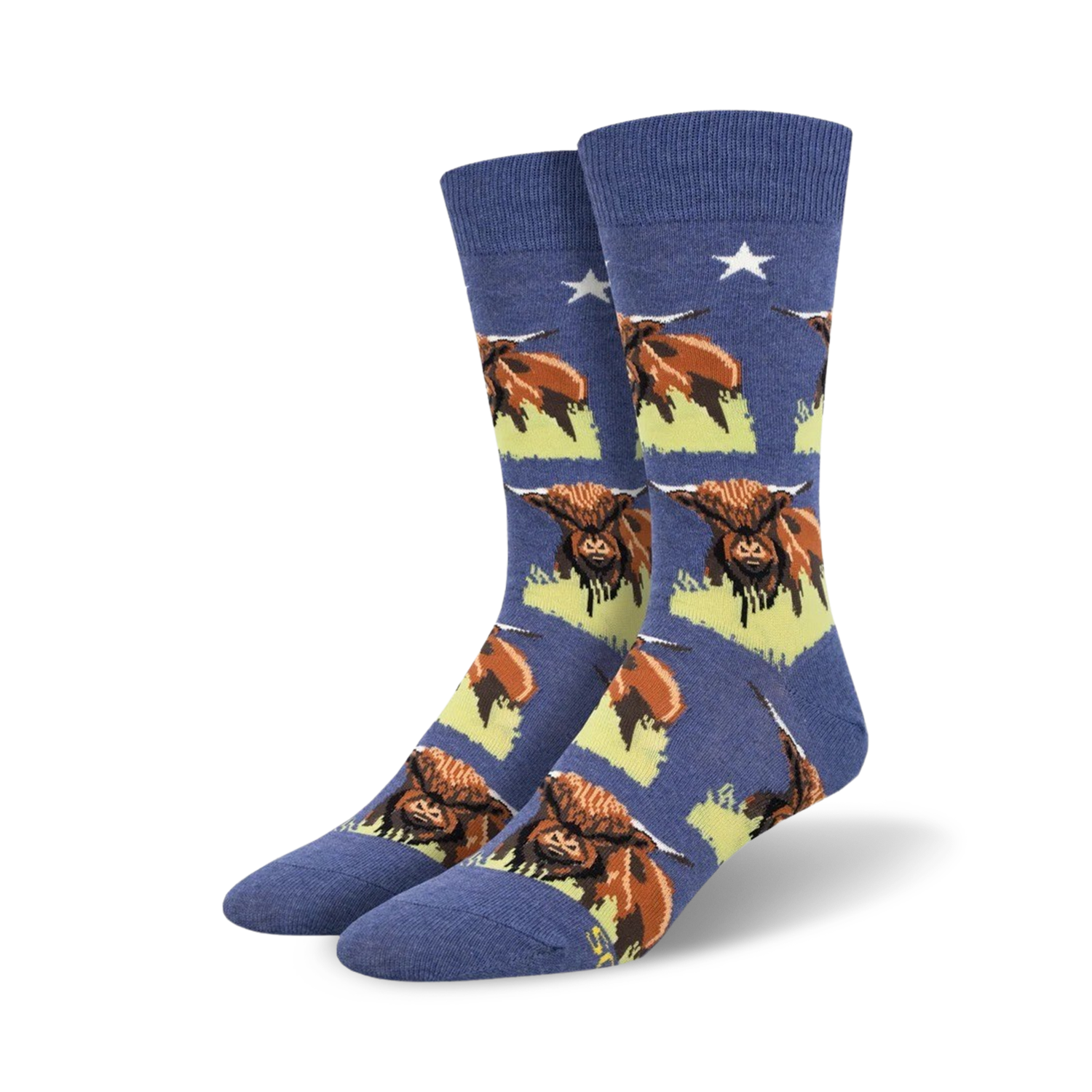 Pair of blue crew socks with a repeating pattern of Highland Cows.  The cows are brown and white, set against a pale yellow background.