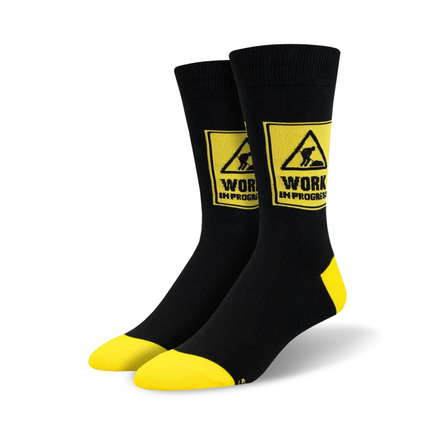 Pair of black crew socks with yellow accents.  A yellow caution sign with 'WORK IN PROGRESS' and a construction worker graphic is featured on each sock.