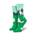 A pair of women's crew socks in teal, green, and white.  The socks feature a fun design of llamas in a grassy landscape with cacti.
