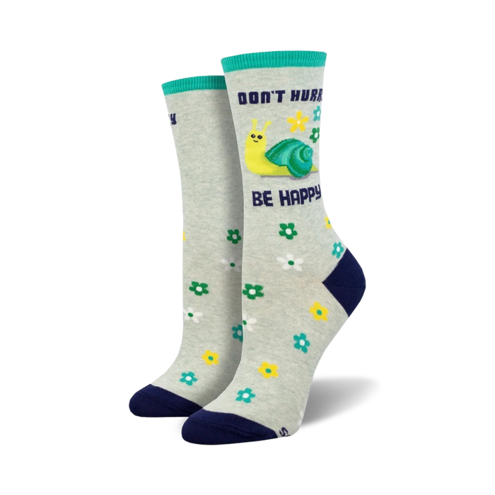 grey crew socks with blue toe, heel, and cuff feature a yellow-shelled snail, pink flowers, and green leaves. 