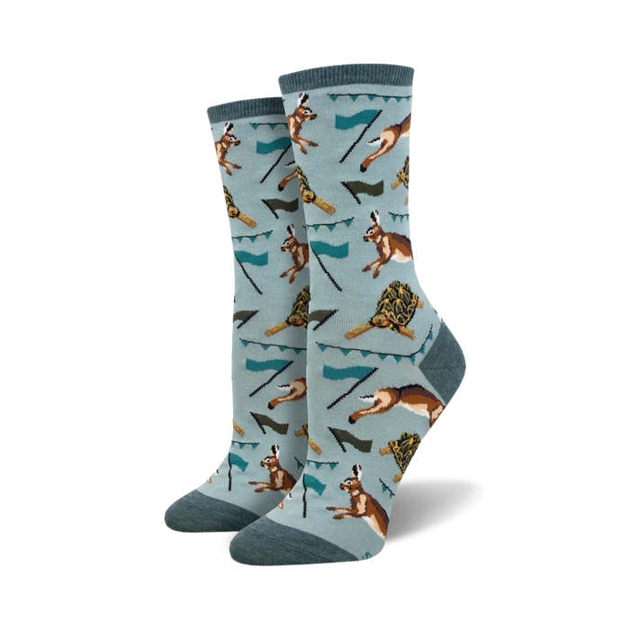 light blue crew socks with pattern of running tortoises and hares. womens. spring theme.   }}
