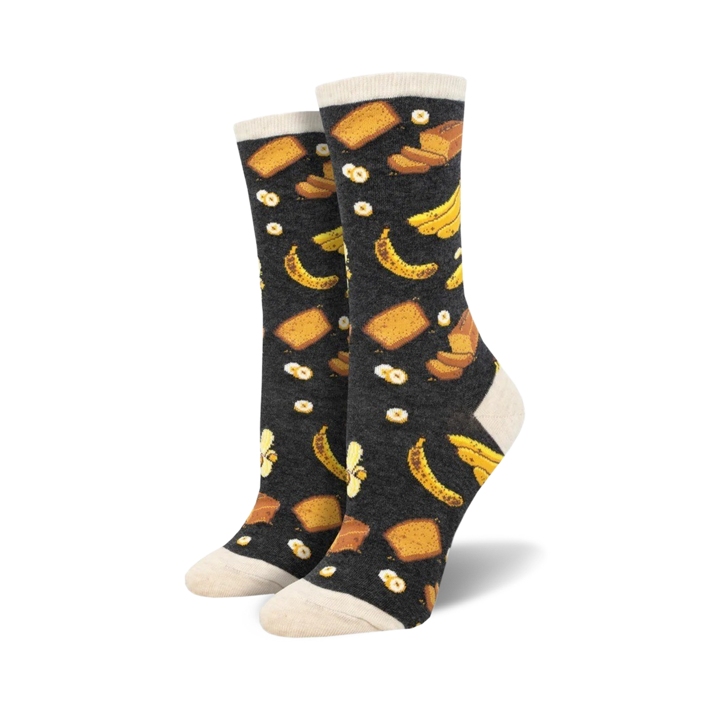 A pair of women's crew socks in dark grey with a whimsical print of yellow bananas and slices of banana bread.
