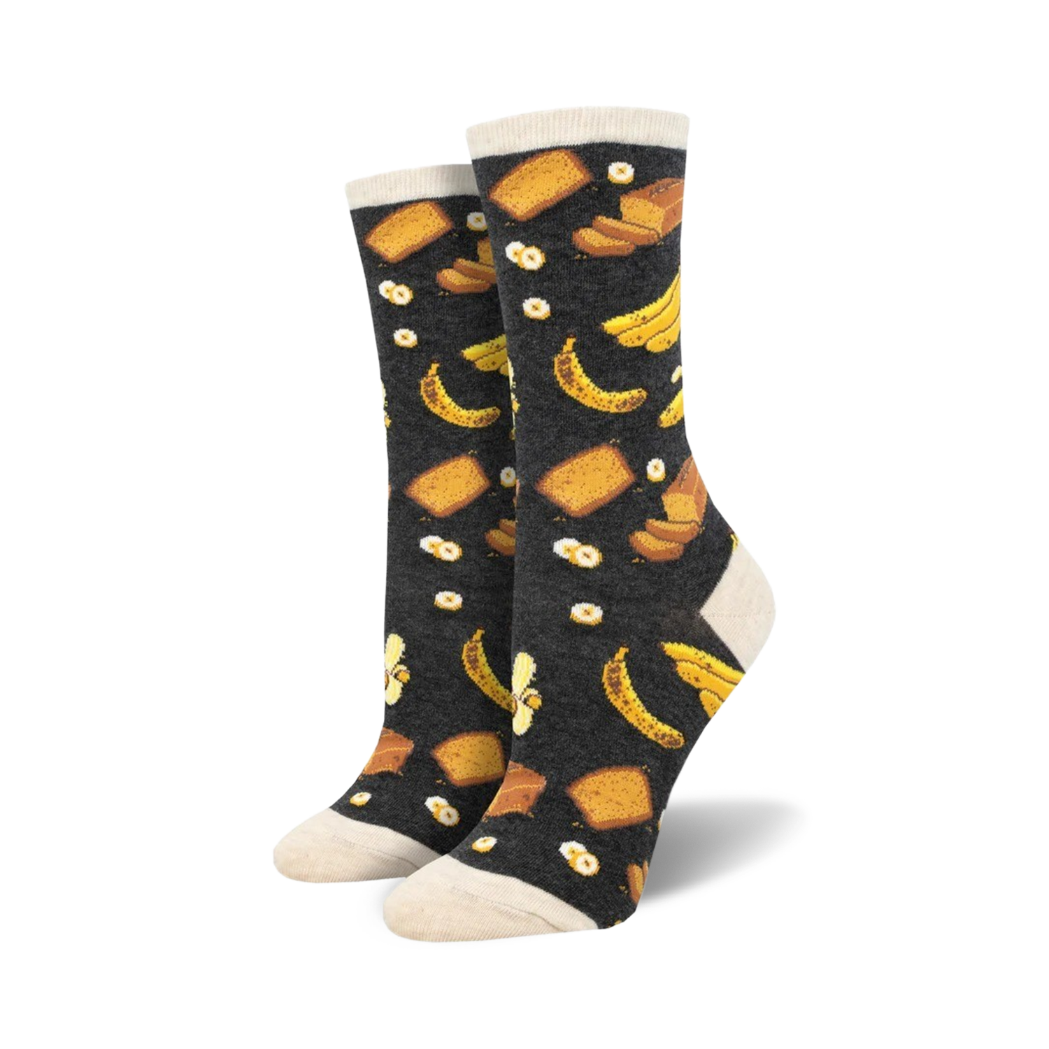 A pair of women's crew socks in dark grey with a whimsical print of yellow bananas and slices of banana bread.
