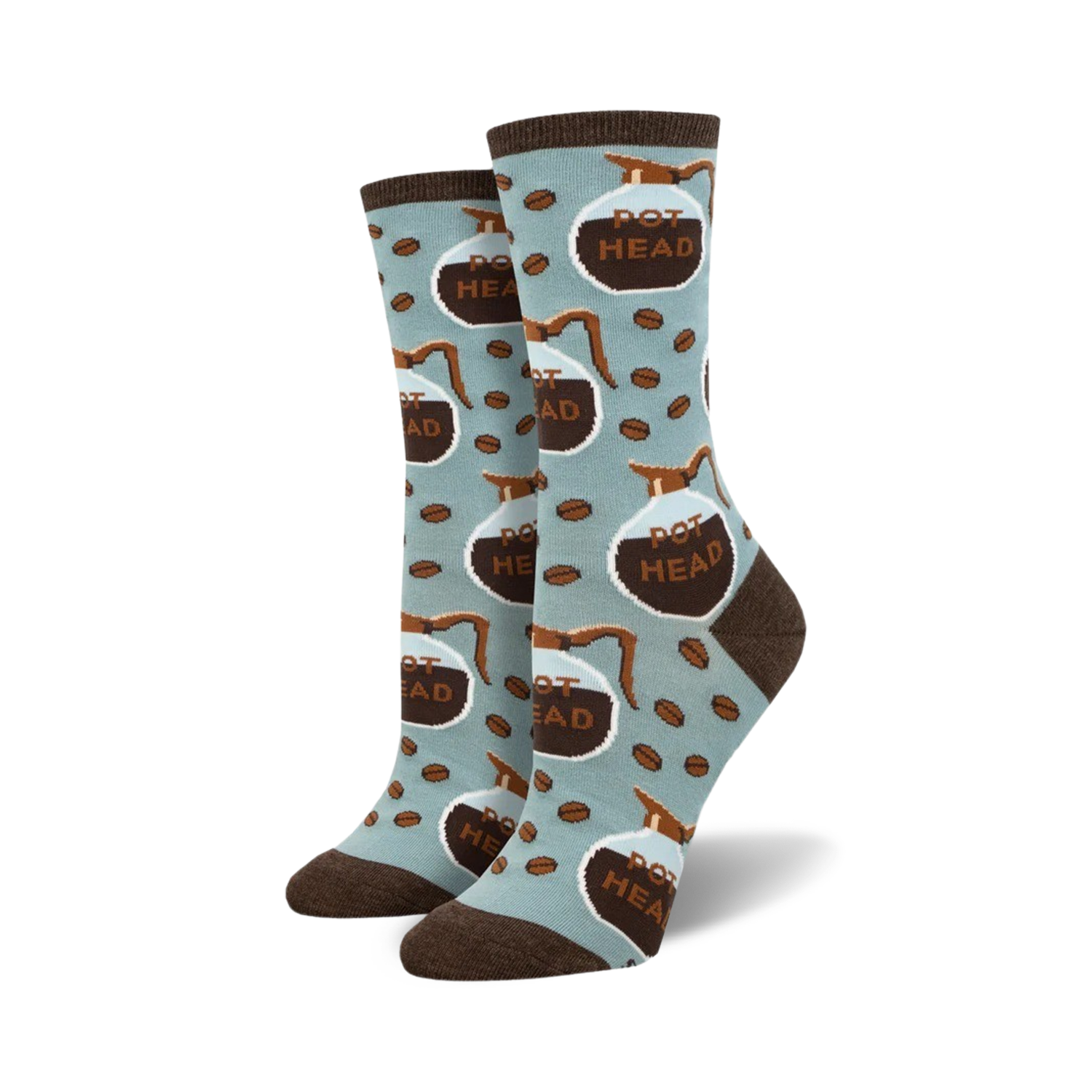 Lifestyle shot of 'Pot Head' socks on a model's feet; light blue socks with brown coffee pot design.
