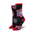 Pair of crew socks with black background and colorful mandala designs in red, purple, and teal. Red accents at the cuffs.
