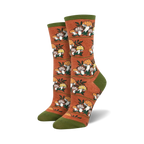 Lifestyle photo showing the orange Magic Mountain socks on a person's feet, suggesting outdoor or nature-related activities.