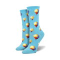 A pair of women's crew socks in light blue with a repeating pattern of multicolored hot air balloons.