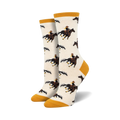 Pair of cream crew socks with a repeating pattern of brown cowboys riding brown horses. Mustard yellow accents at the cuffs.
