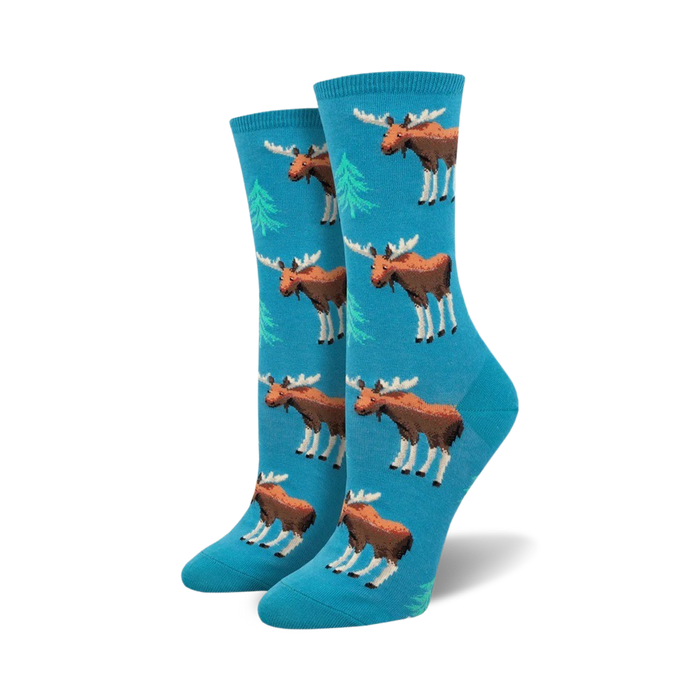 blue crew socks with a cartoon moose and green spruce tree pattern. these women's socks are made for adventurous and fun loving people.   }}