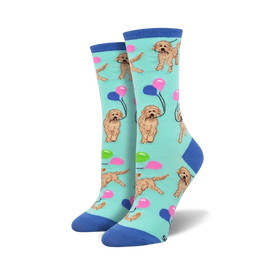 light blue crew socks with a pattern of golden doodle dogs holding strings of balloons in their mouths.  