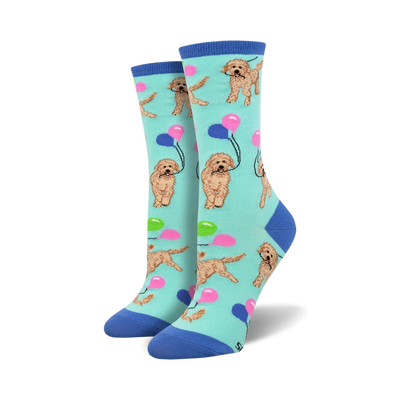 light blue crew socks with a pattern of golden doodle dogs holding strings of balloons in their mouths.  